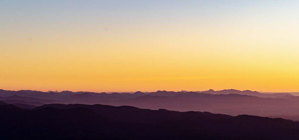 outdoors silhouette of mountain during golden hour sky