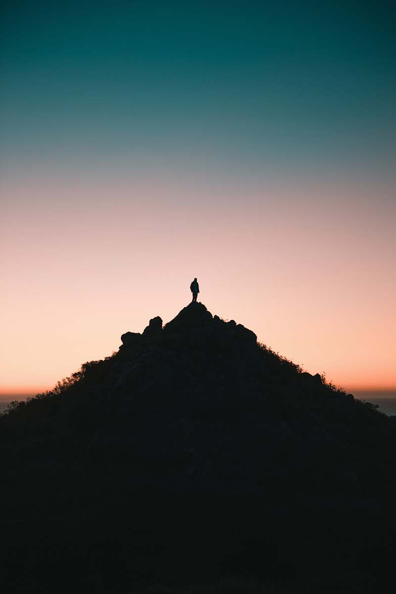 outdoors silhouette of person on top of hill during golden hour sky