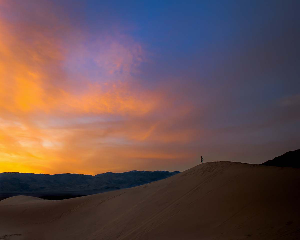 soil silhouette of person standing on mountain sand