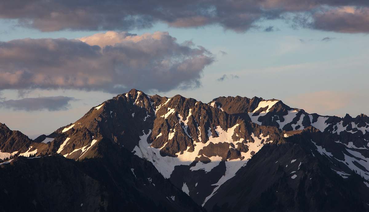 mountain snow capped mountain under blue sky mountain range