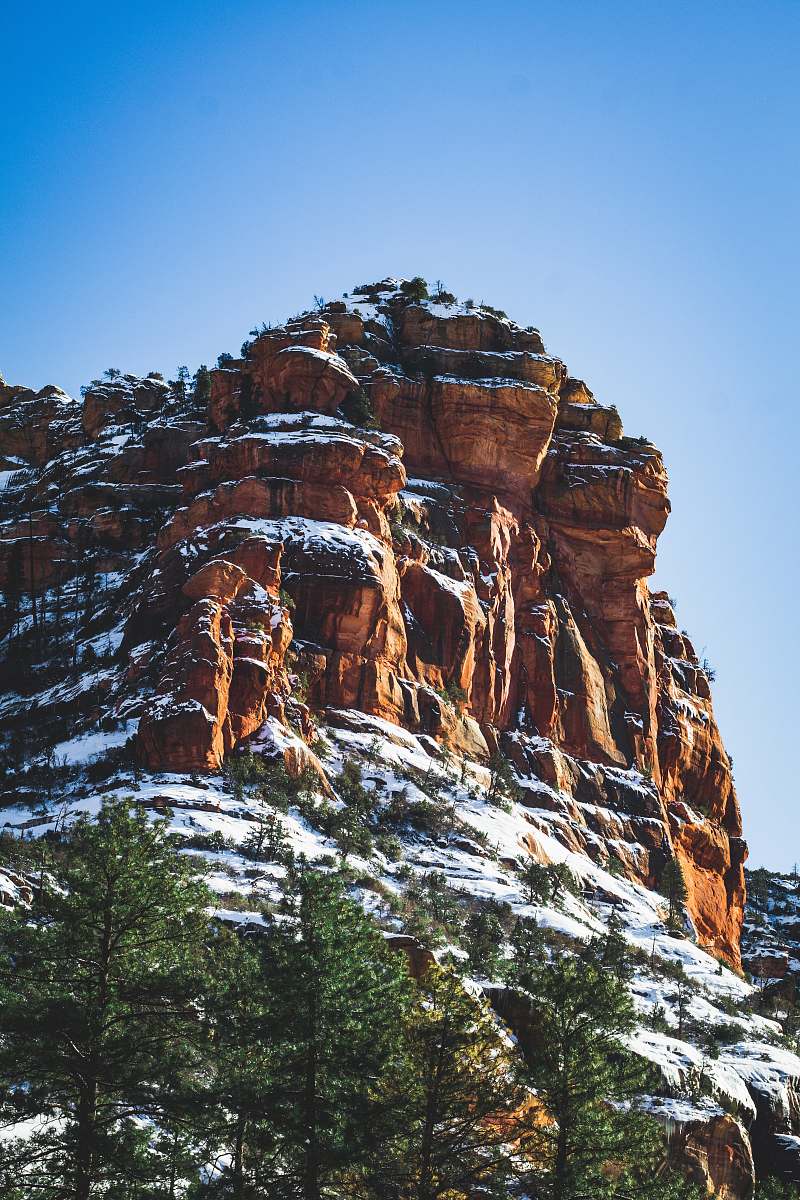 outdoors snow covered brown mountain during daytime mountain