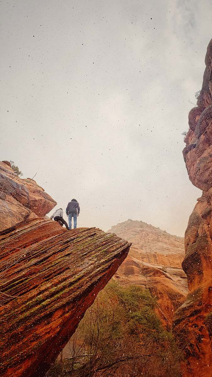 mountain two person standing on mountain cliff outdoors
