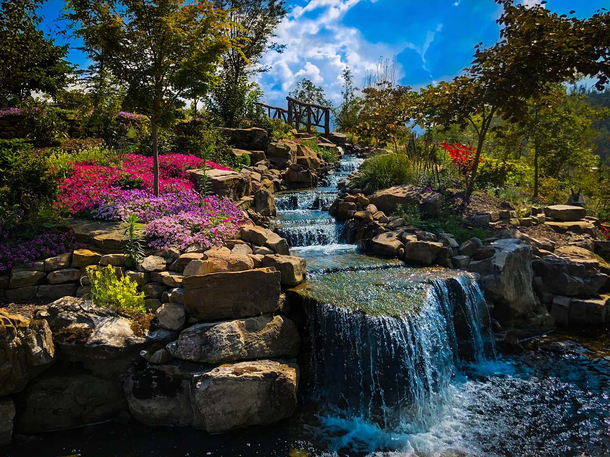 outdoors waterfall between trees water