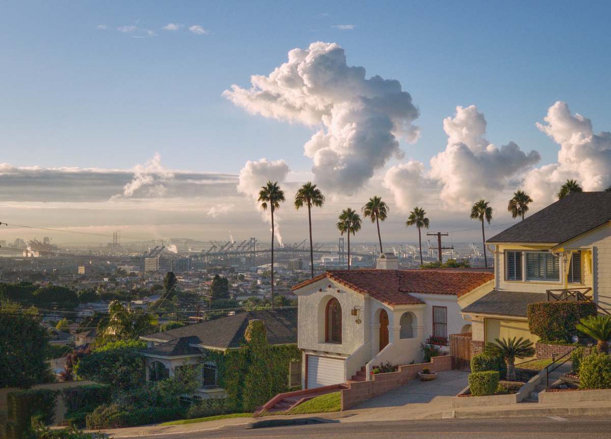 weather white and brown houses under blue sky sky
