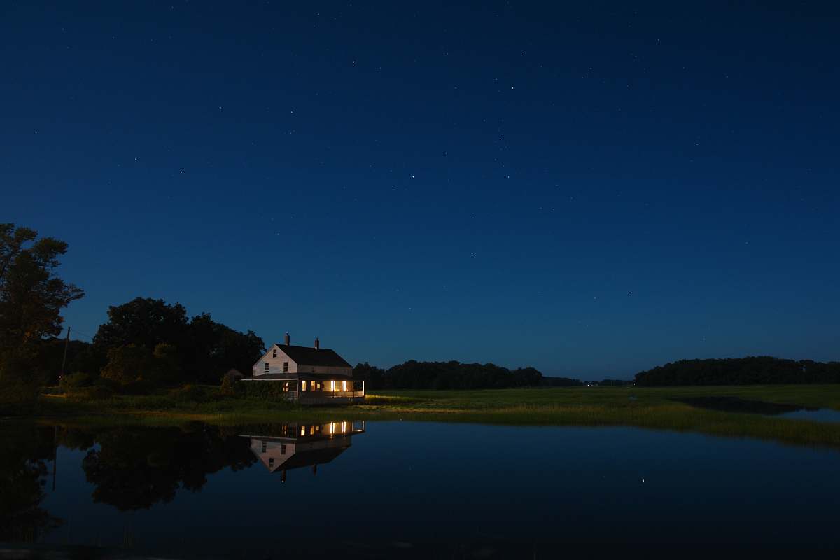 outdoors white house under blue sky night