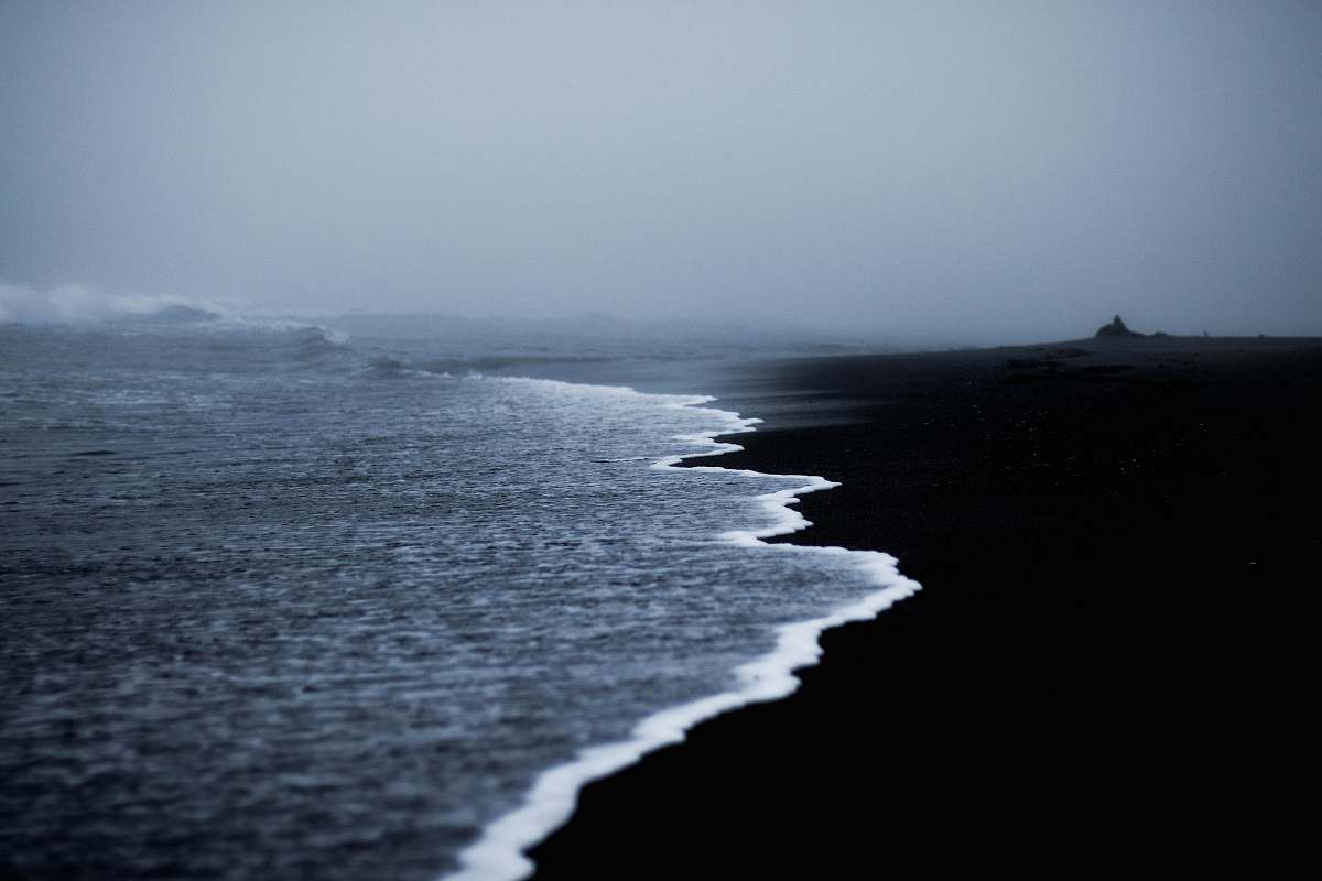 coast ocean water under gray sky water