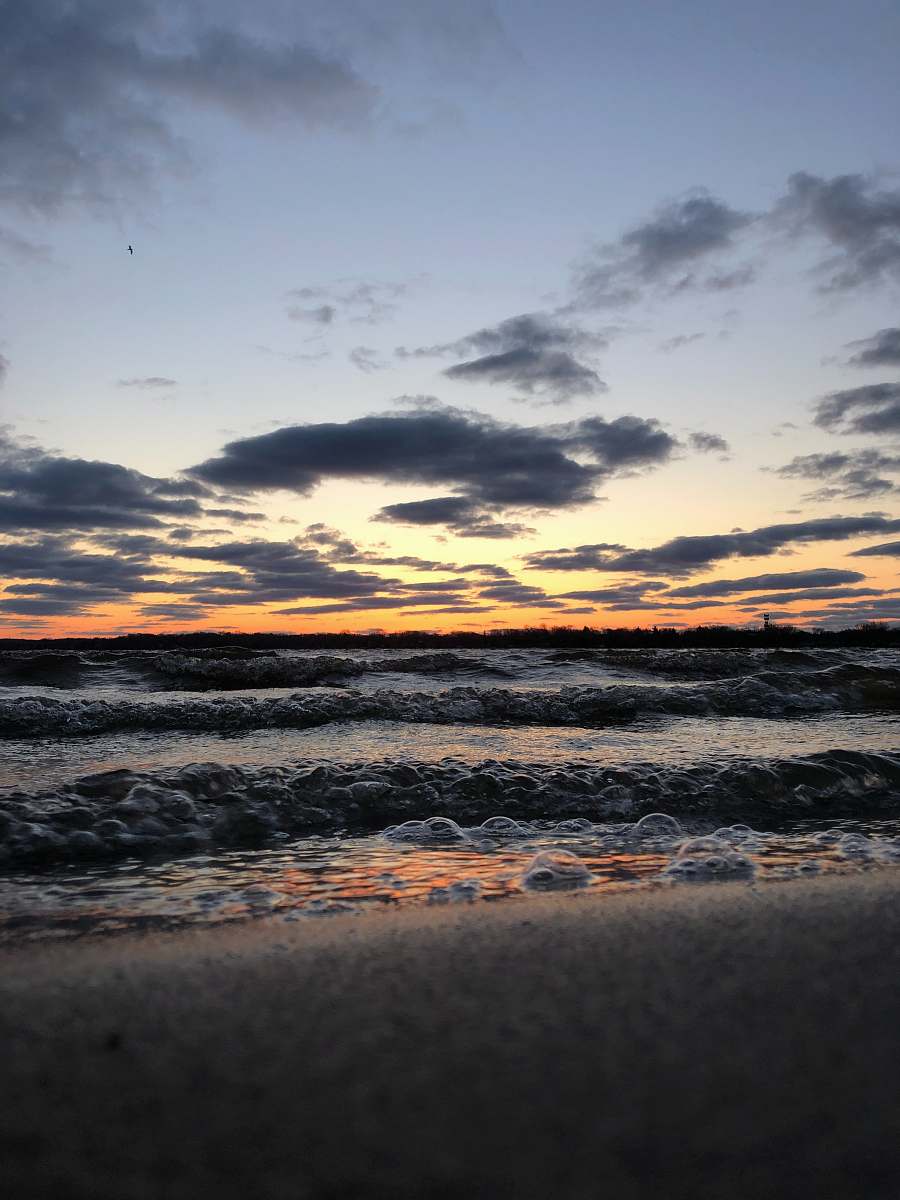 nature sea waves crashing on shore during sunset outdoors