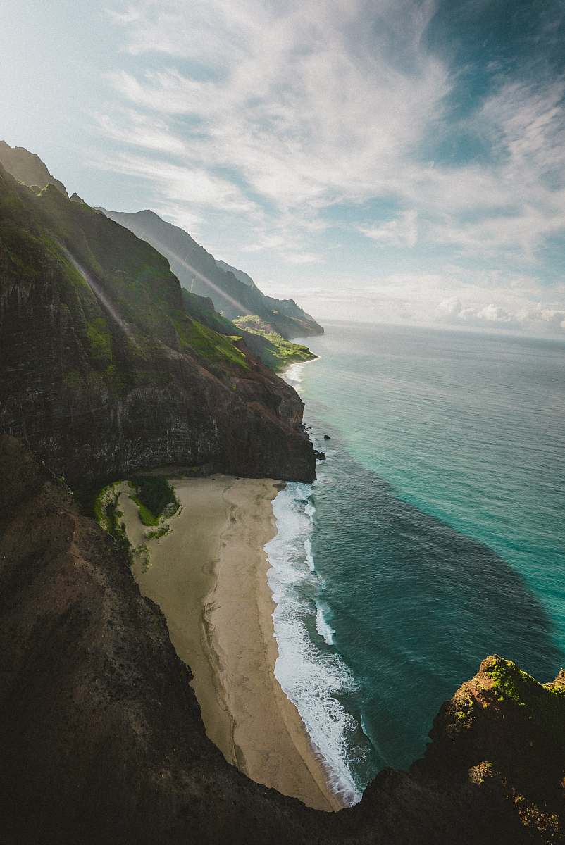 nature aerial photography of sea under cloudy sky during daytime ocean