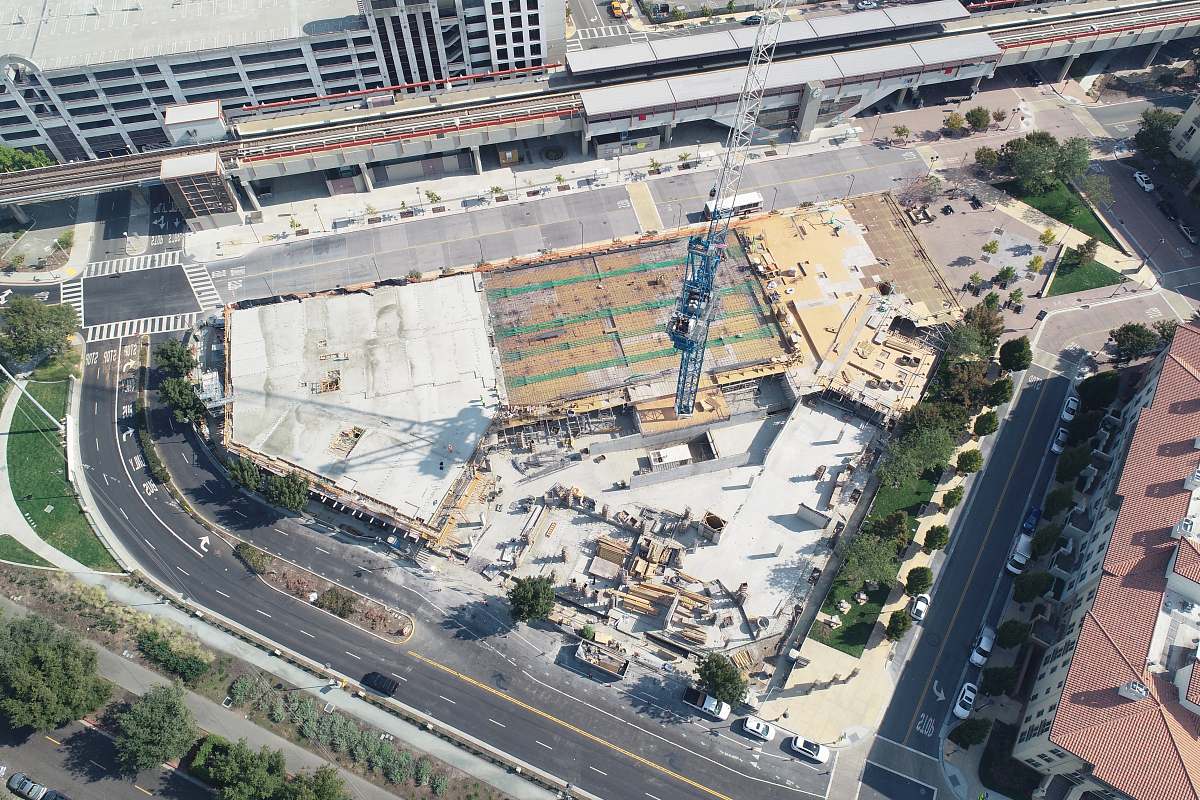 road aerial photography of tower in the middle of building landscape