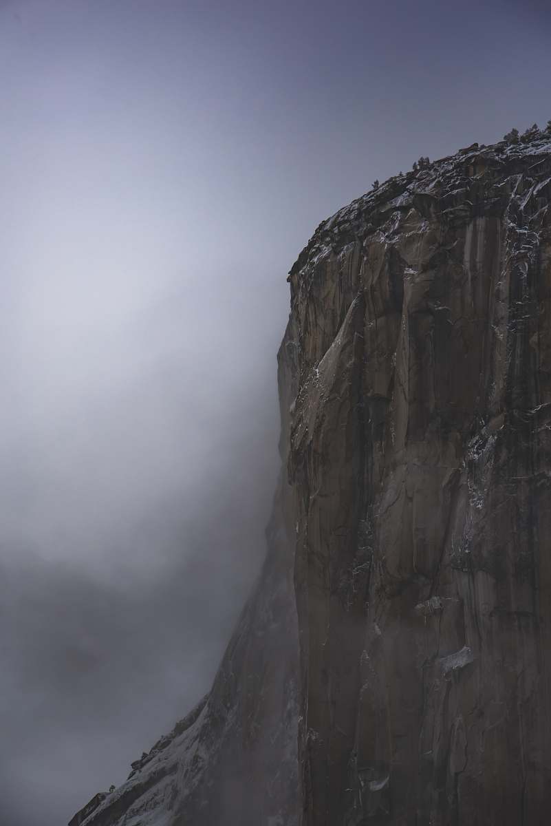 grey brown rocky mountain under white cloudy sky photo cliff