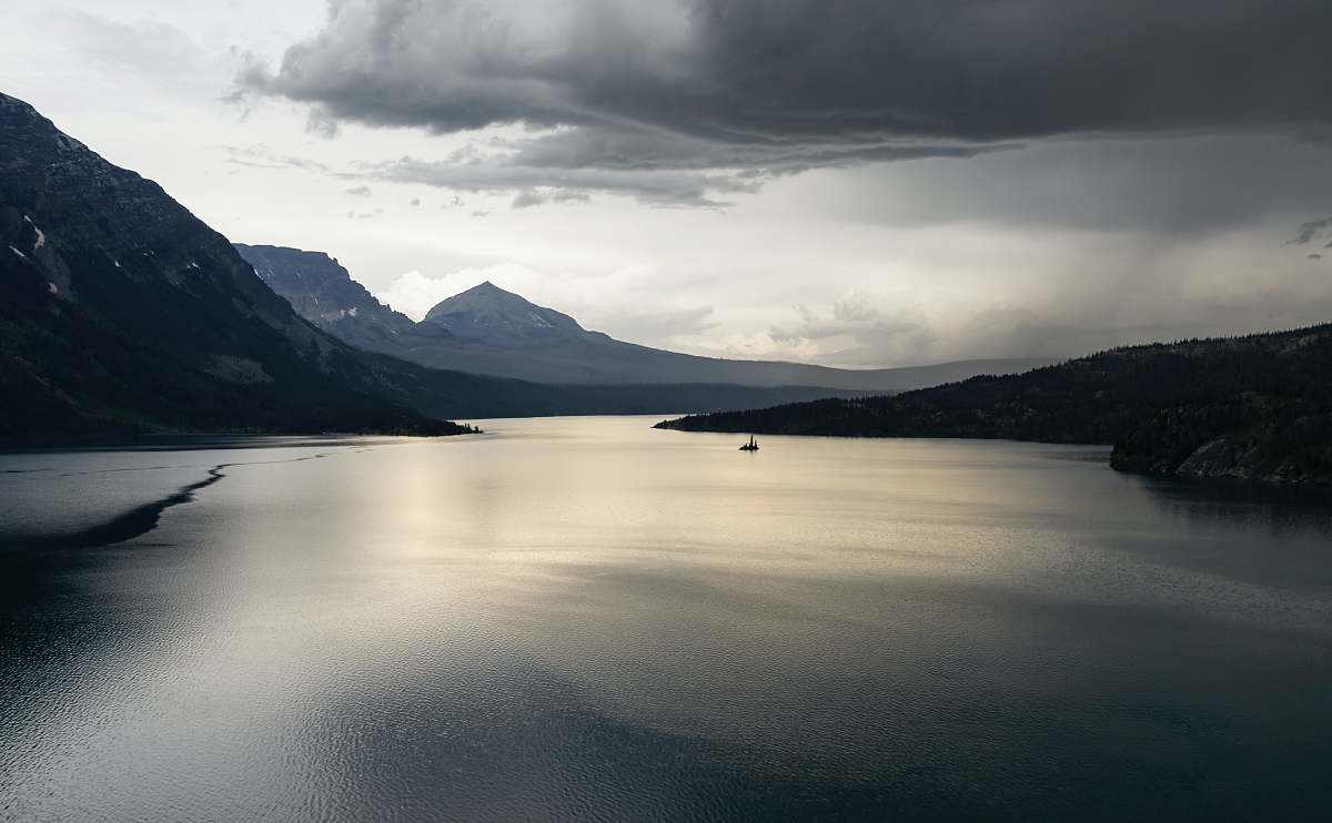 nature calm body of water near mountain under white cloud formation mountain