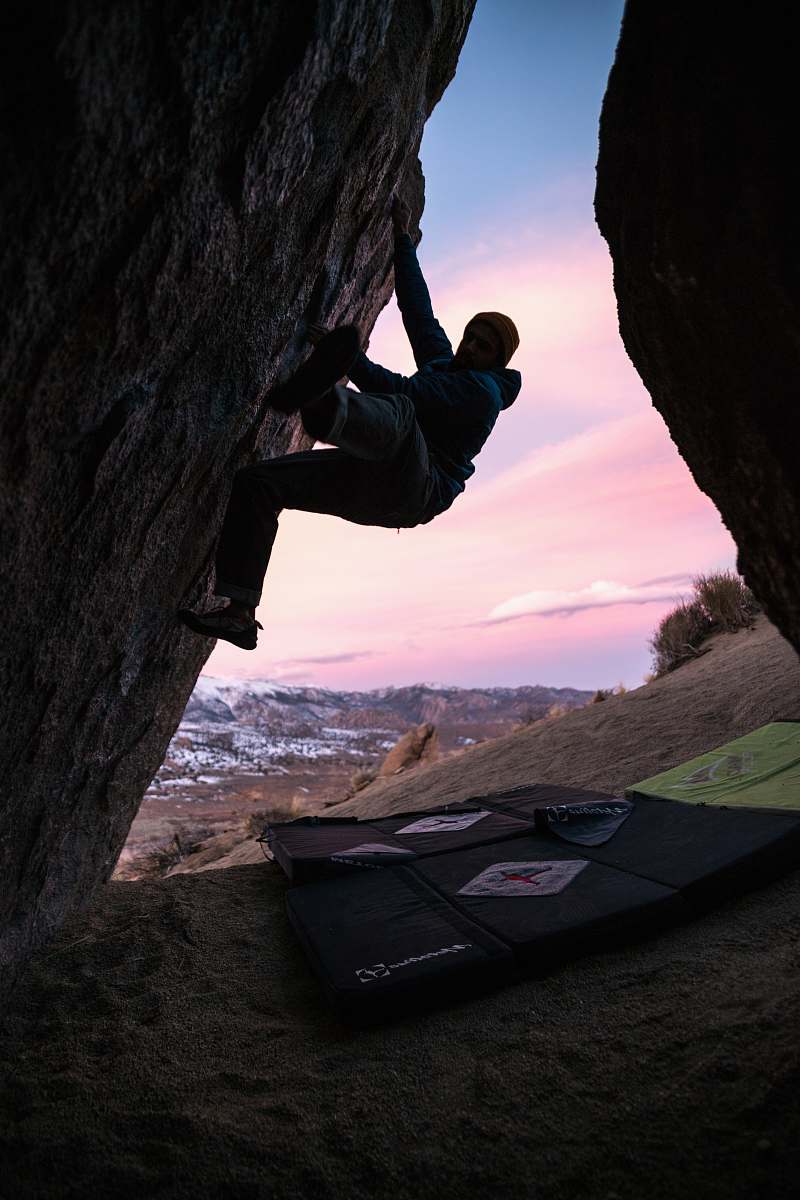 adventure man hiking on rock formation climbing