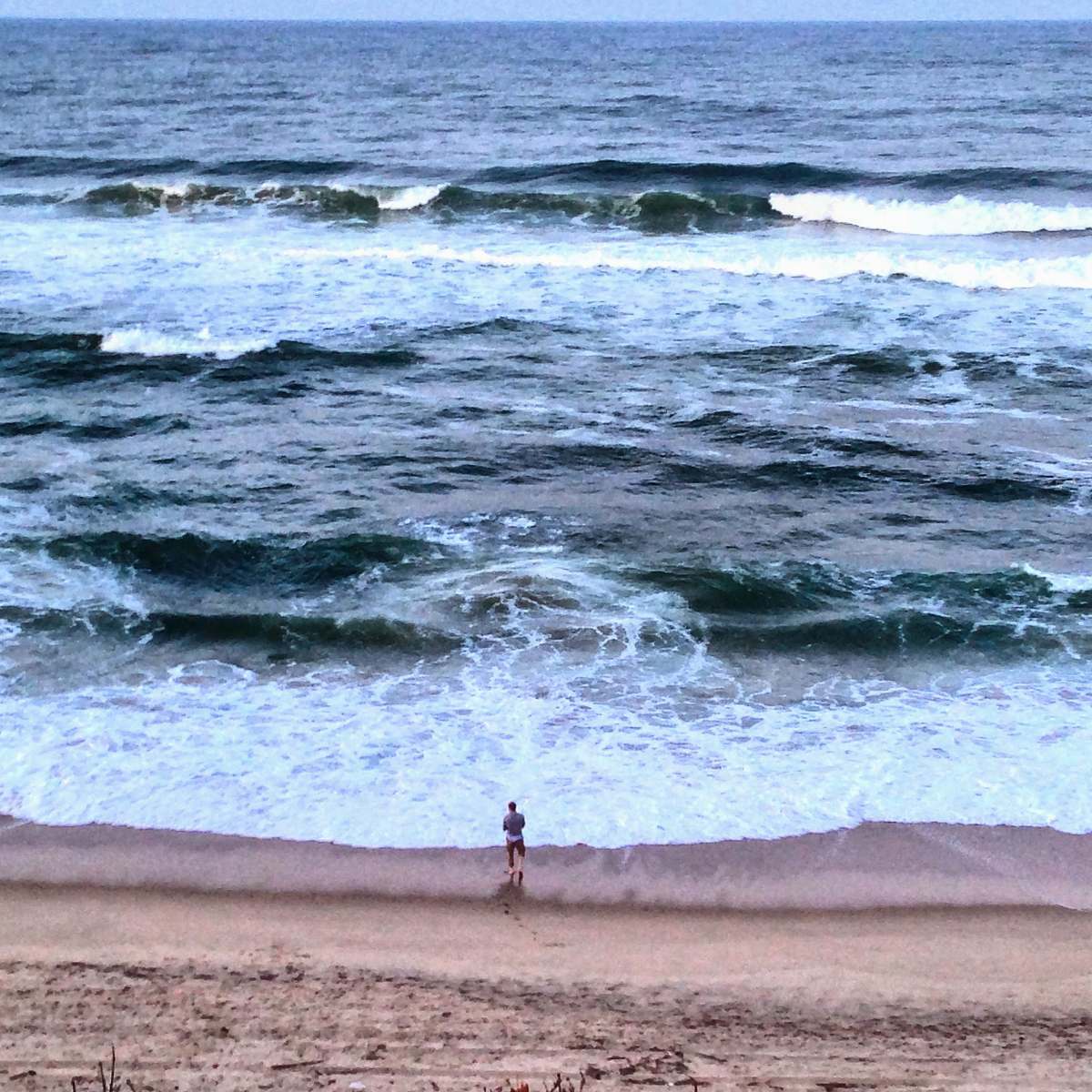 sea man standing seashore water