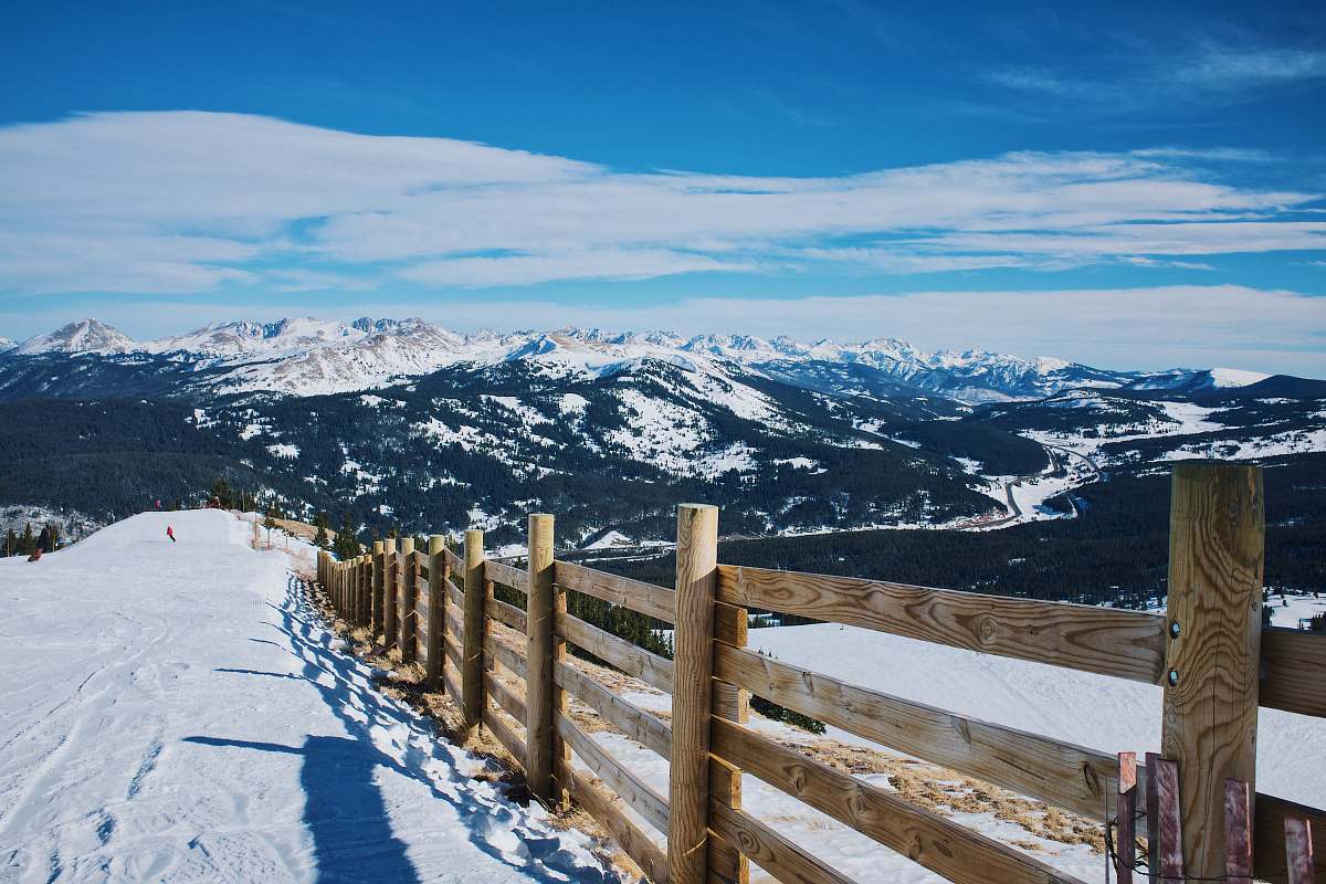 mountain snowfield and brown wooden fence near mountain at daytime alps