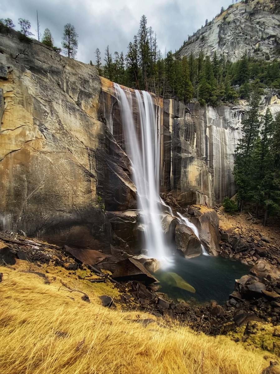 nature waterfalls in the middle of the forest during daytime river