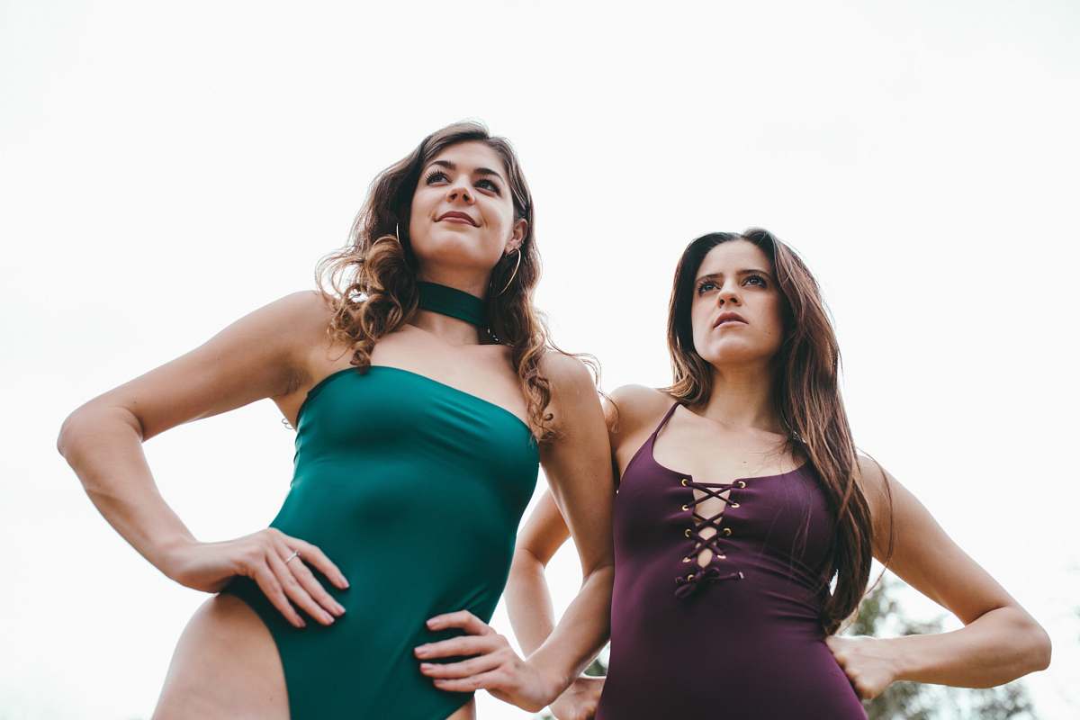 human low-angle photography of two women wearing swimsuits person