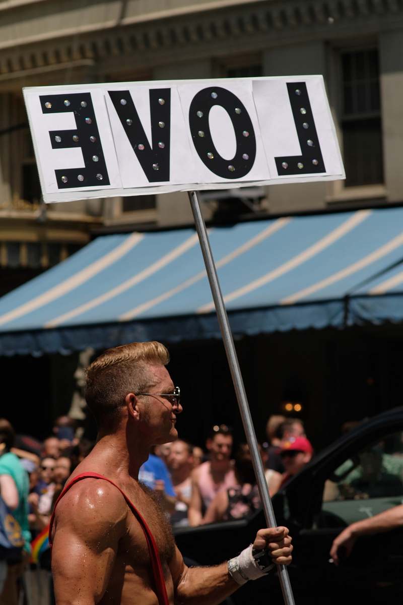 human man holding love banner person