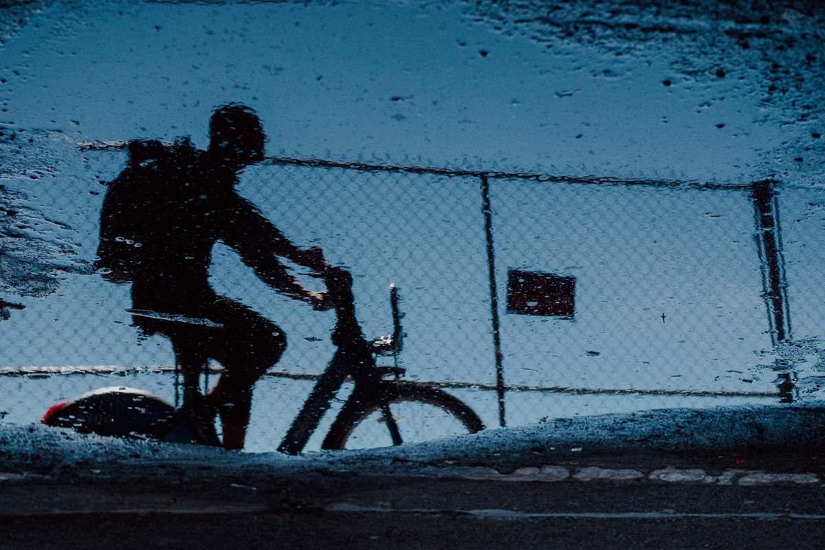 human man on bicycle grayscale photo person