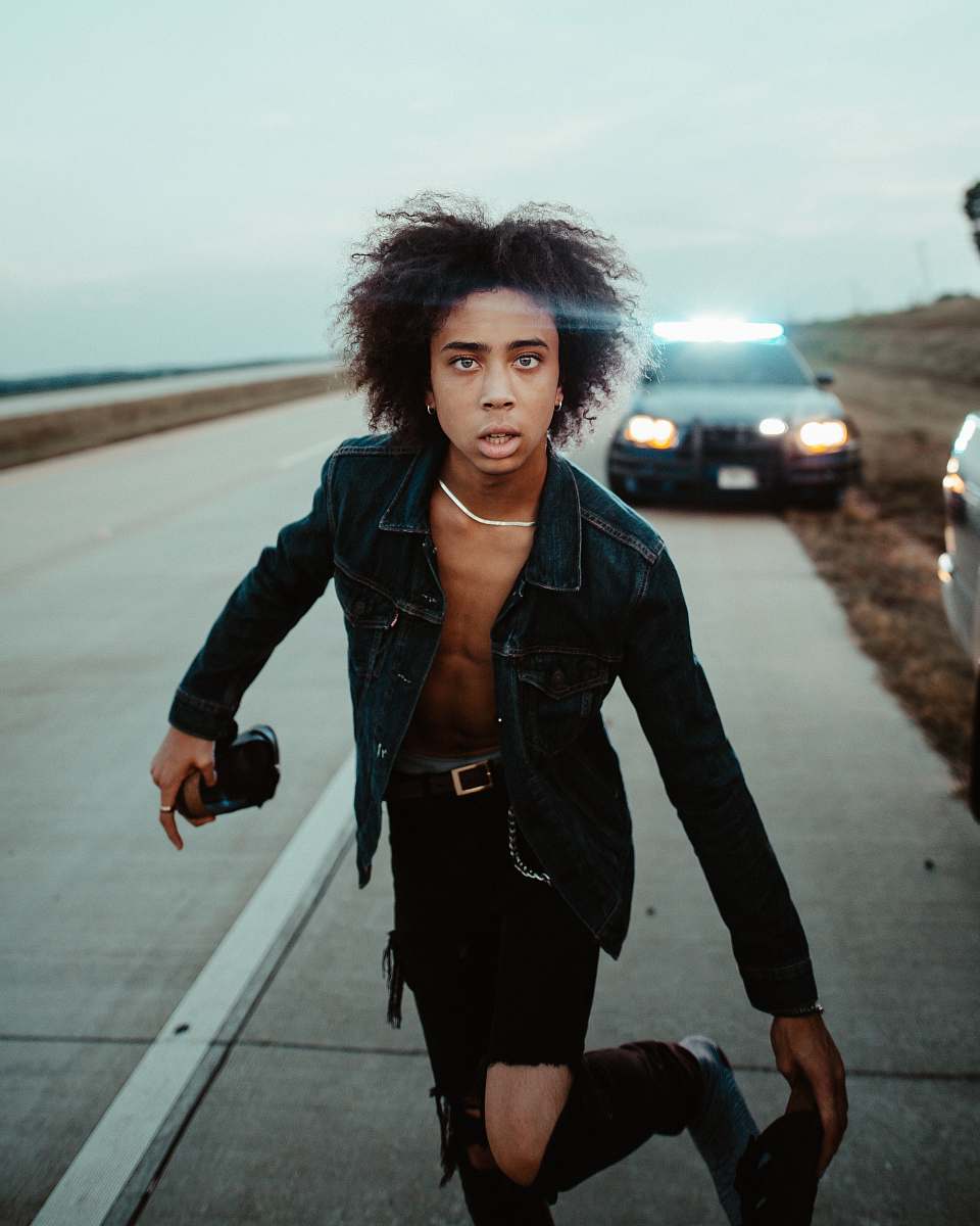 person man standing in the middle of highway human