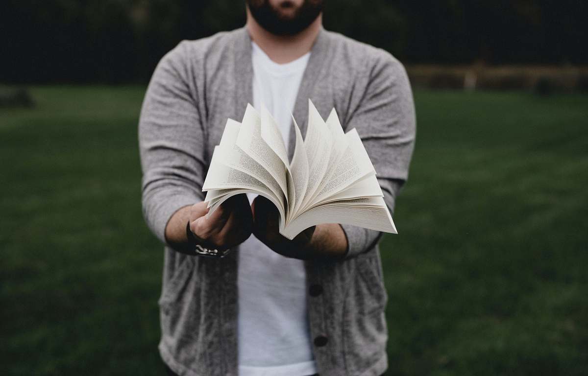 human person opening book person
