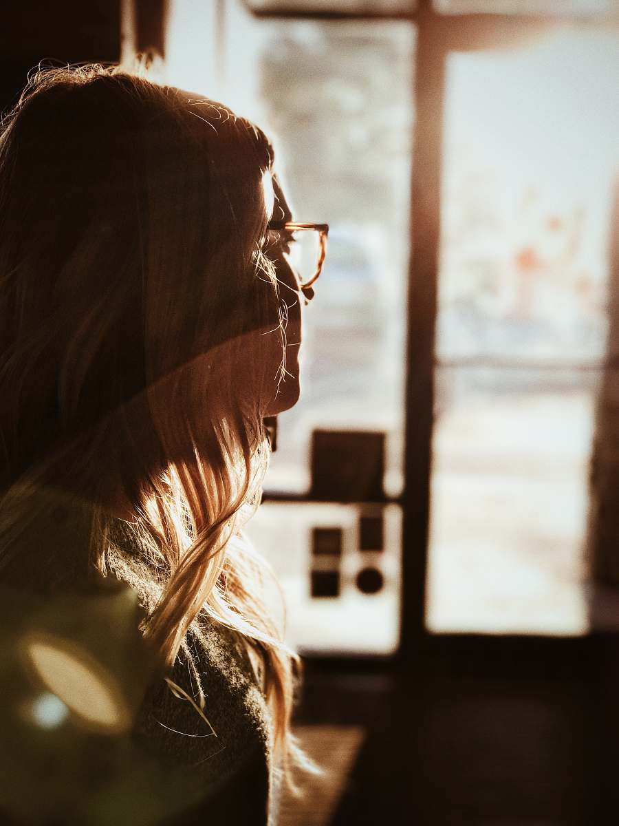 woman shallow focus photography of woman facing door bellbrook