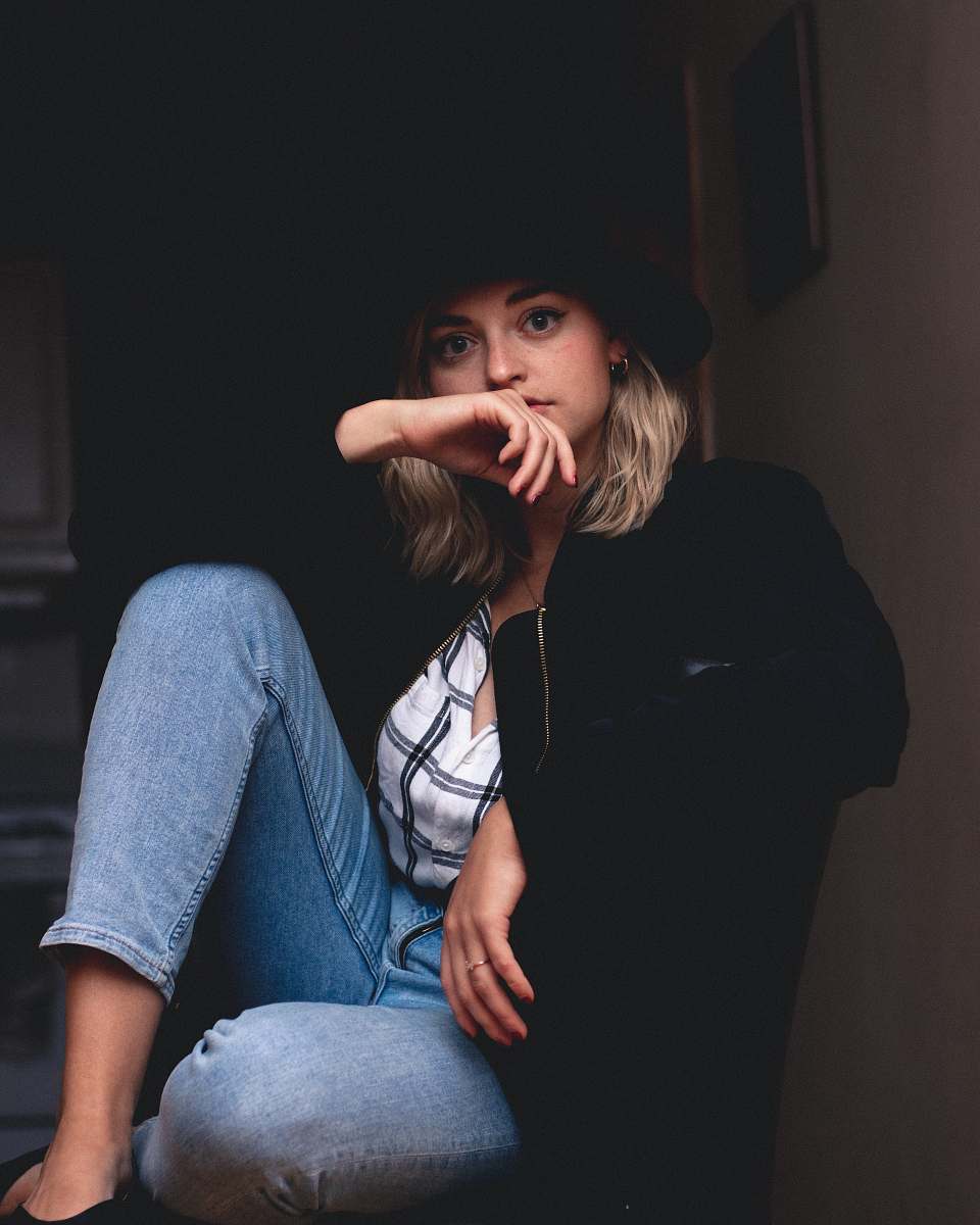 person woman in blue jeans and black jacket human