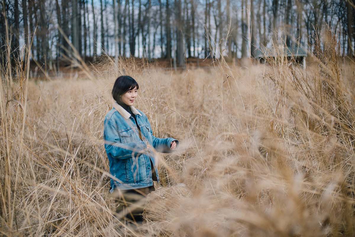 human woman walking on brown grass field person