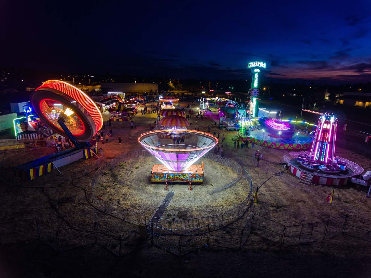 human amusement park at night festival