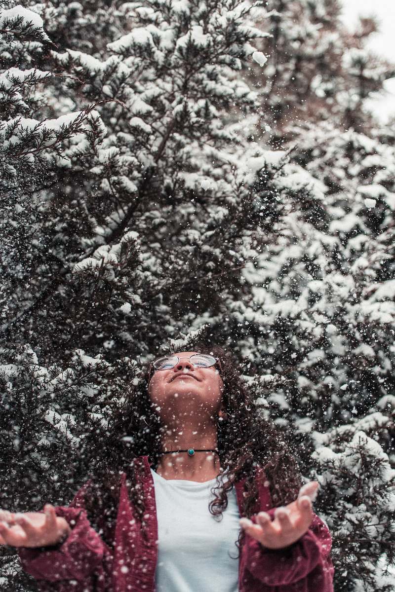 human girl leaning above during with snow people