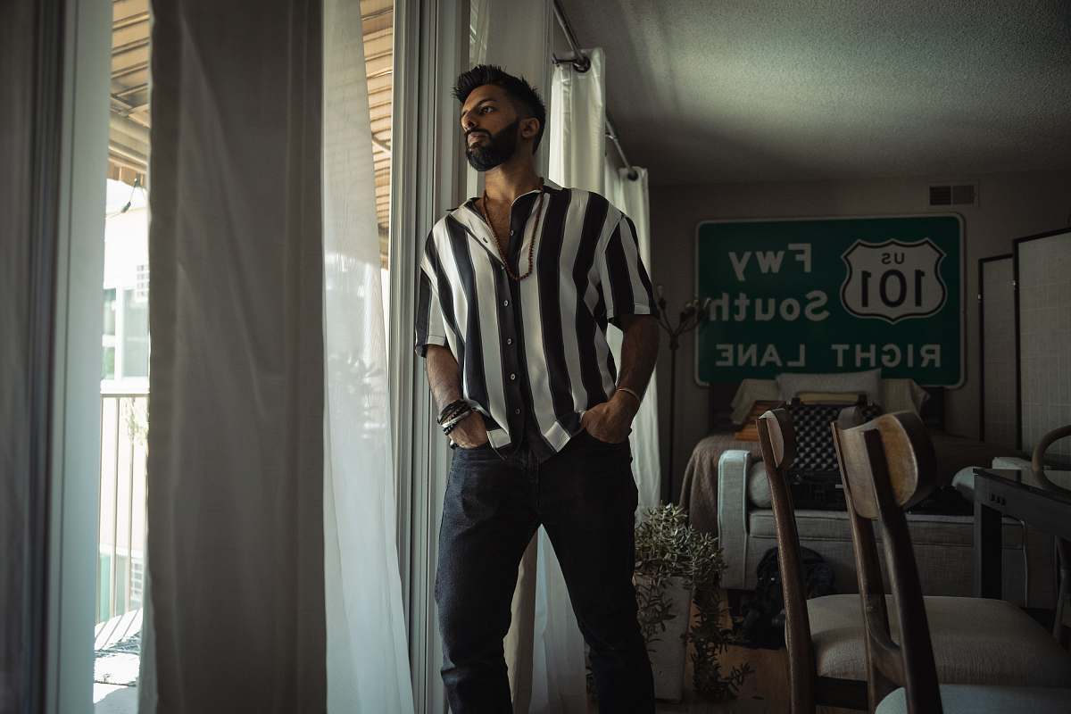 human man leaning on the glass window furniture