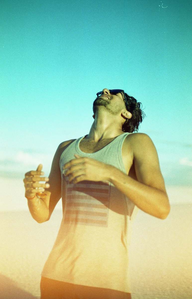 human man wearing gray tank top and sunglasses people