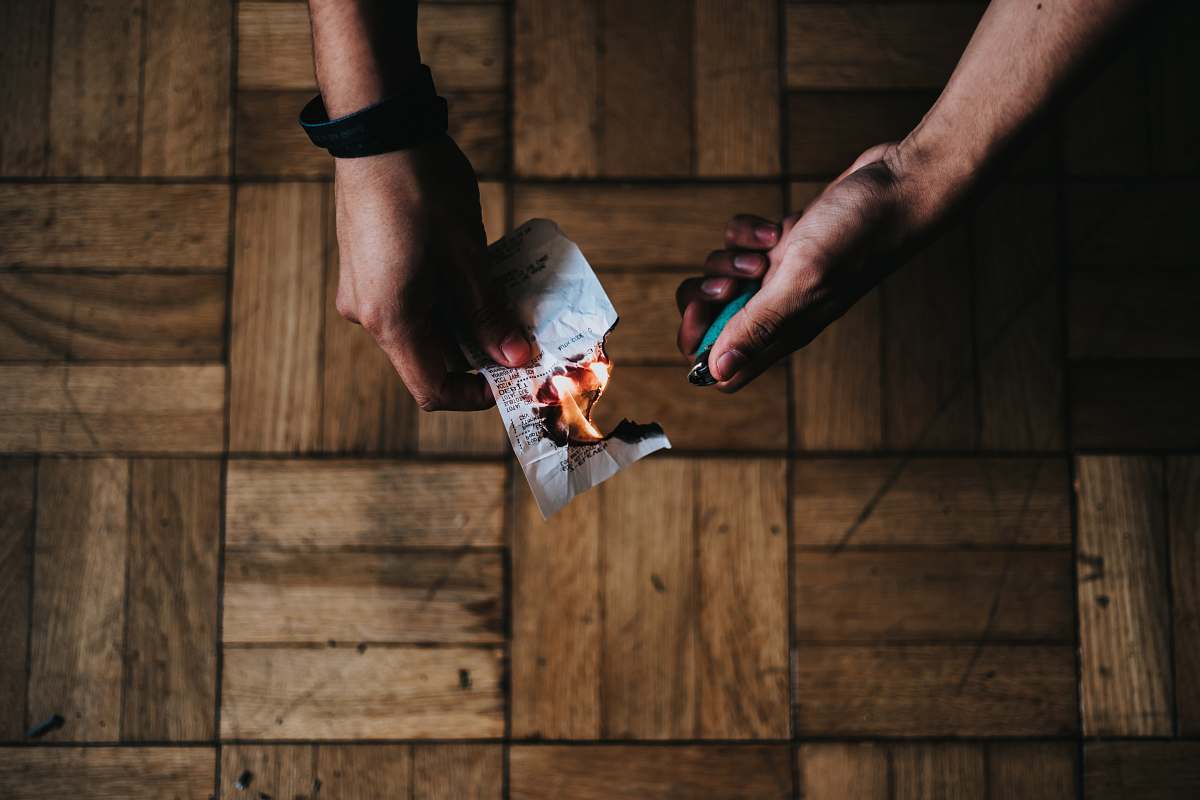 human person burning paper people