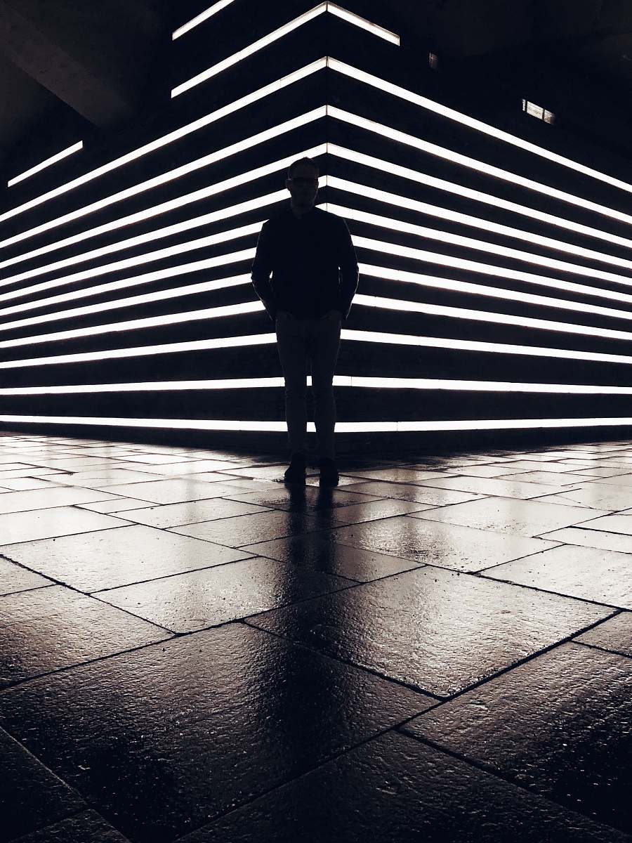 human silhouette photography of standing person flooring