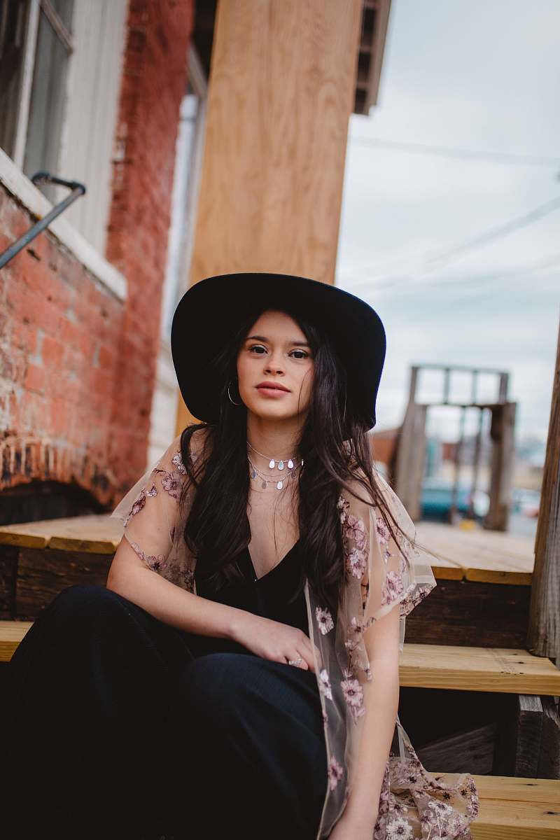 human woman sitting on brown wooden stairs people