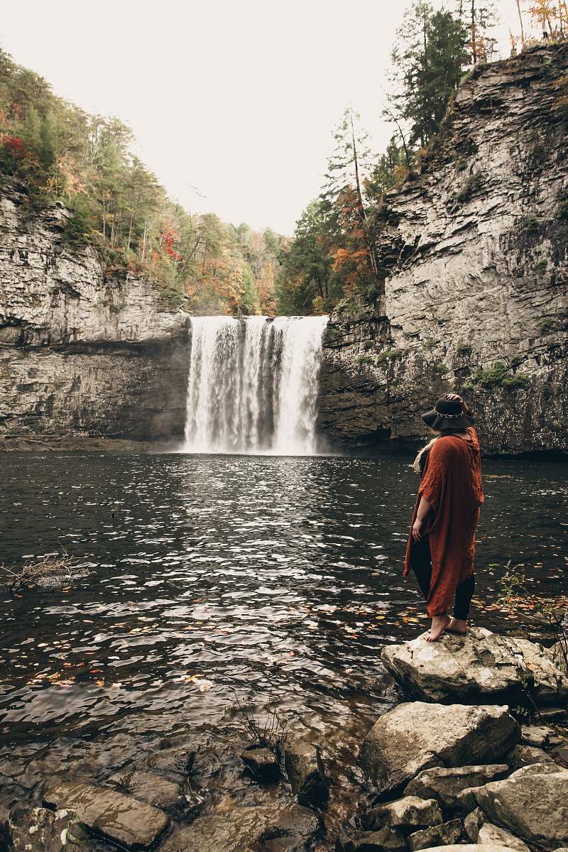 water woman standing near waterfalls nature