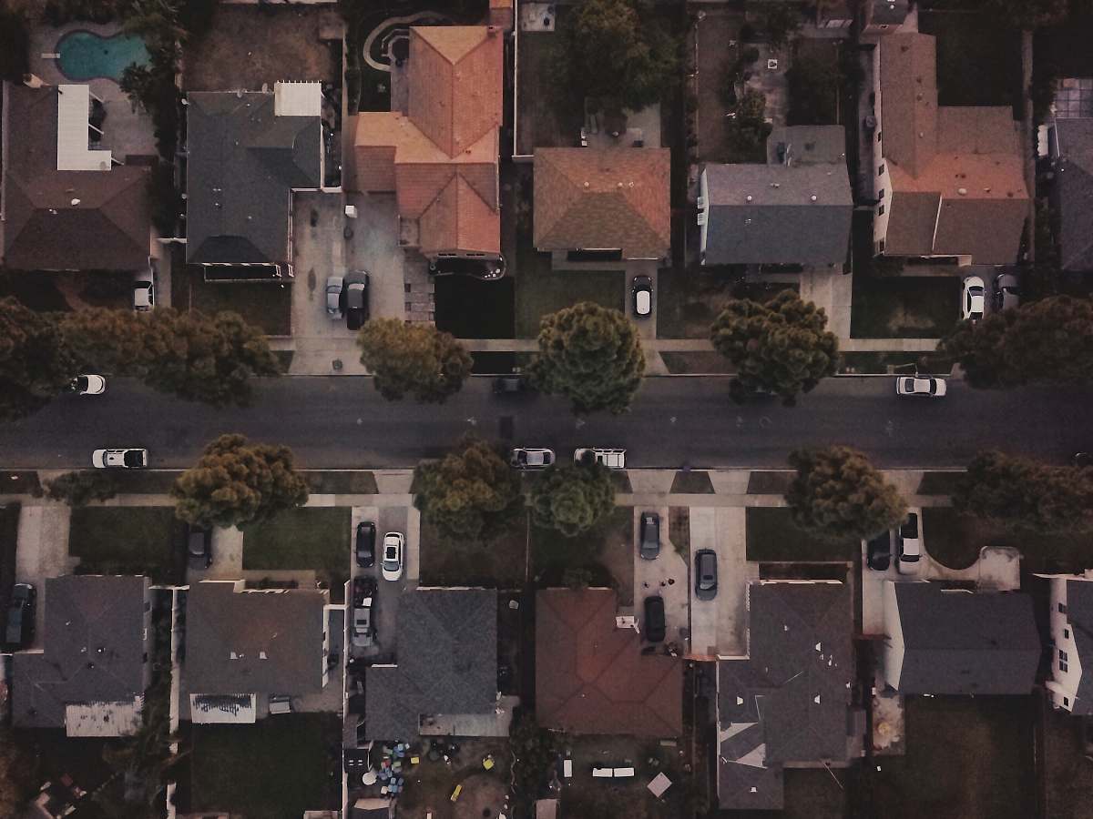 flora aerial photography of residential area during daytime jar