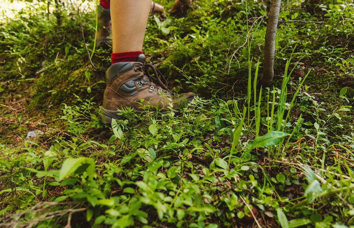 colorado person wearing hiking shoes standing on green grass shoe