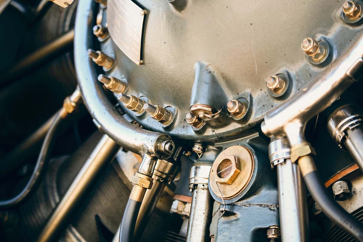 machine close up photography of gray engine part mechanical