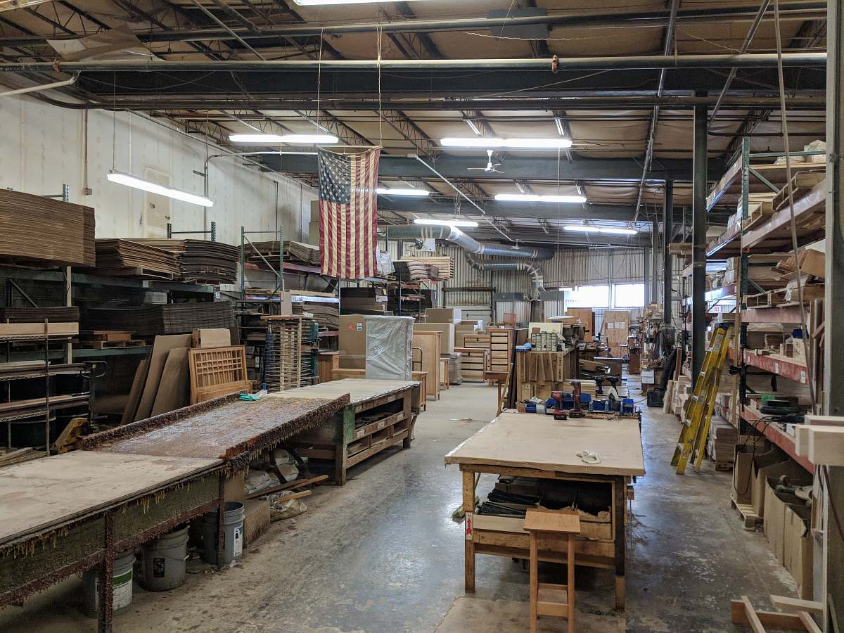 wood brown wooden table near hanging flag of U.S.A. furniture