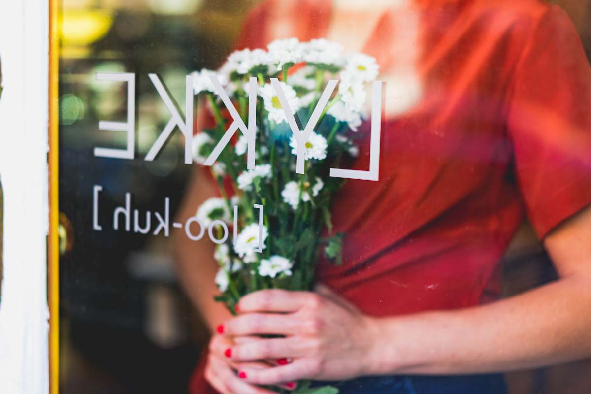 flora woman holding flowers at daytime jar