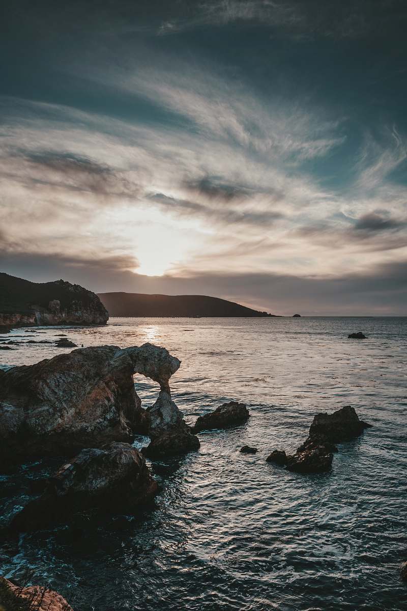 ocean rock near body of water water