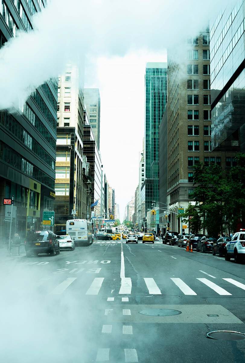 building cars on asphalt road intersection