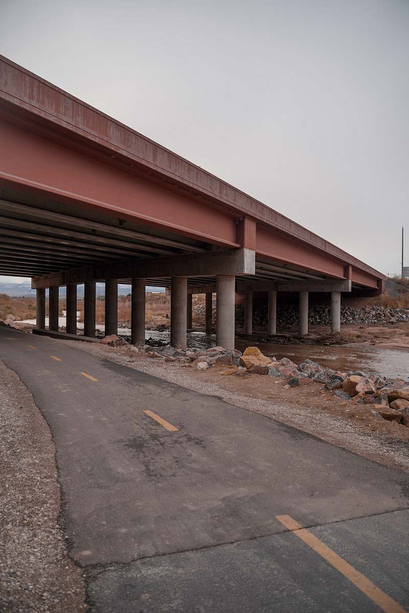 freeway concrete bridge above road and body of water overpass