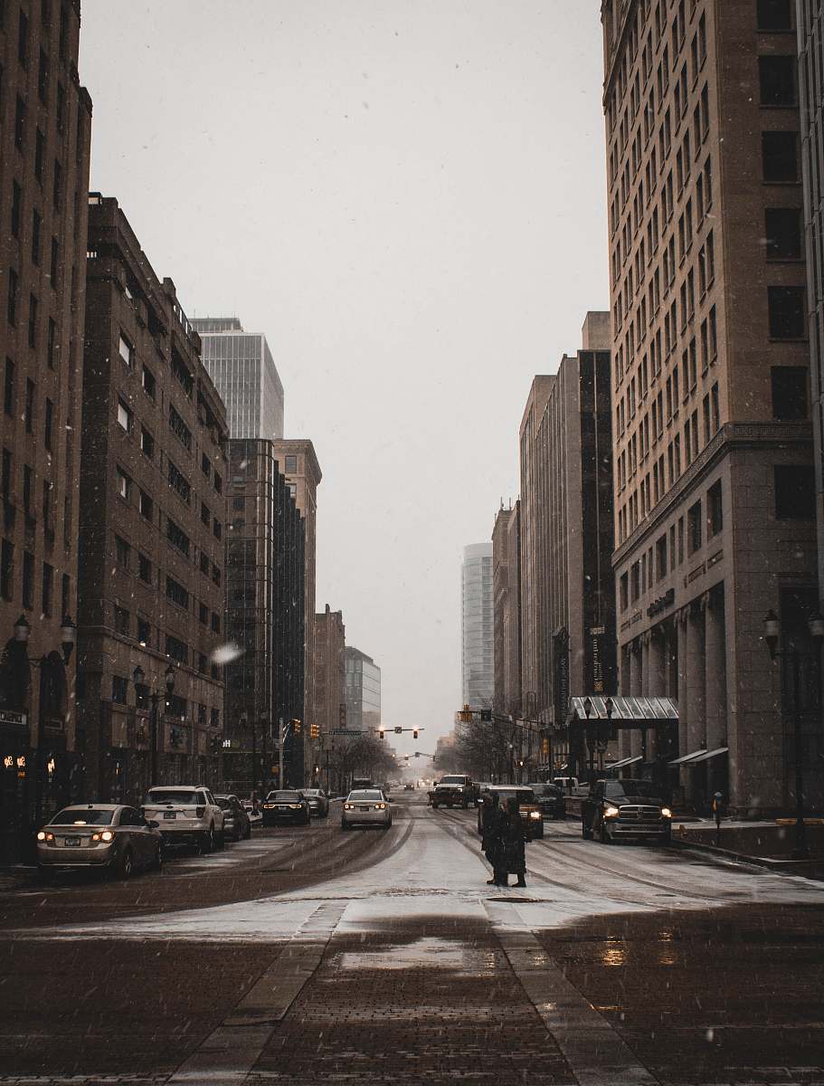 intersection road with buildings under white sky asphalt