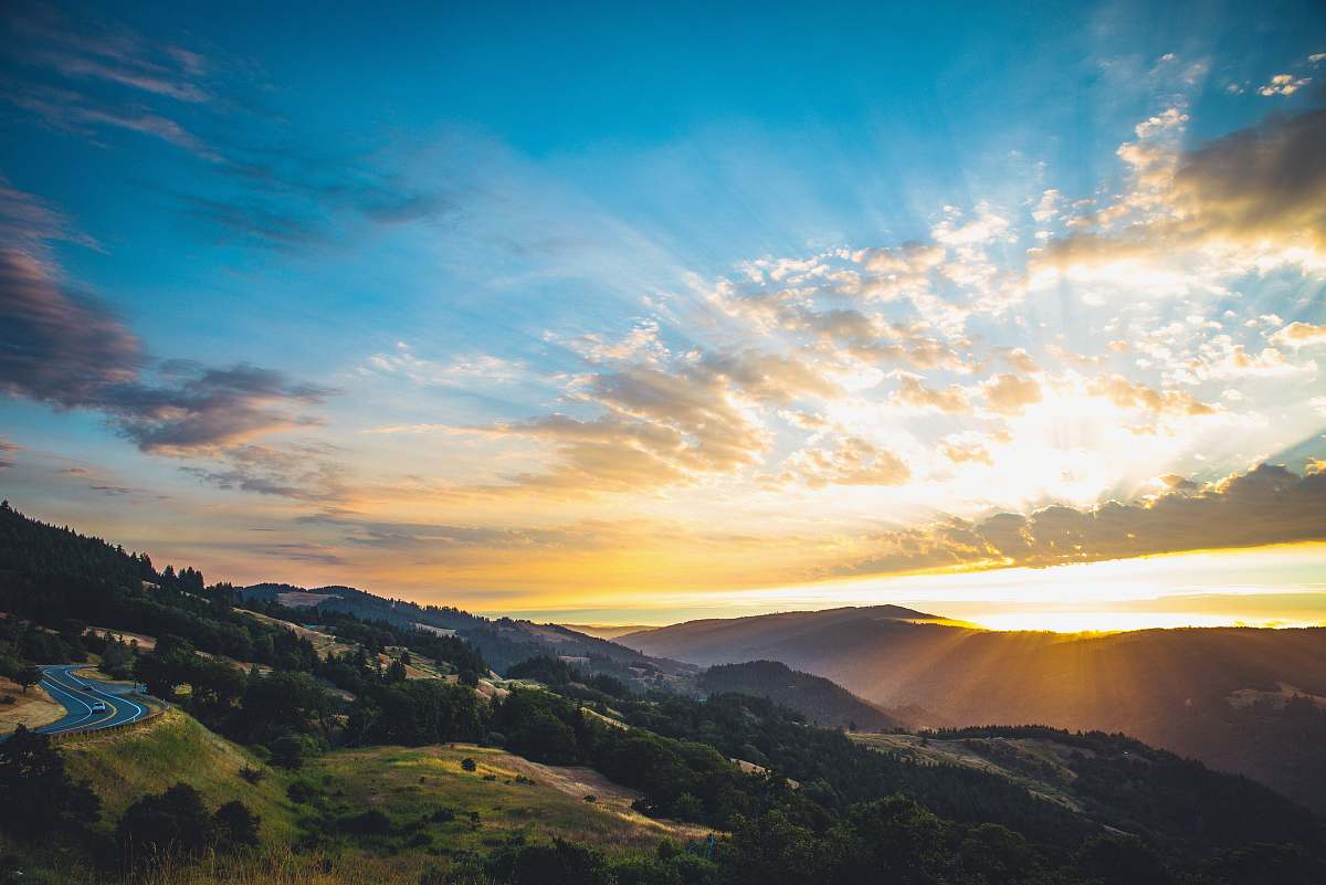 nature mountains and road during golden hour outdoors