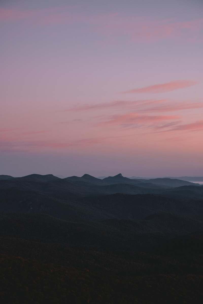 sunset silhouette of mountains under pink sky sunrise