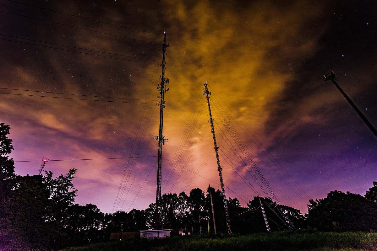 dawn two brown utility poles during golden hour dusk