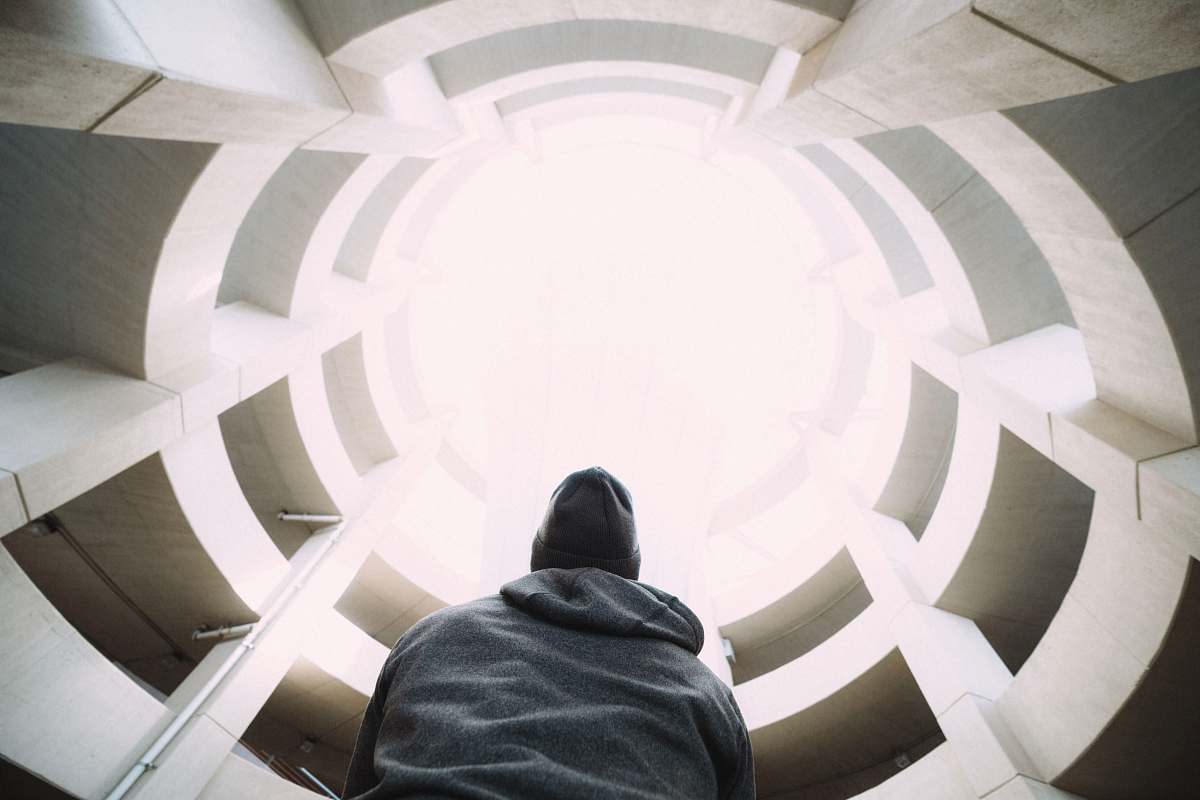pink photography of person wearing gray hooded jacket inside building during daytime raleigh-durham international airport