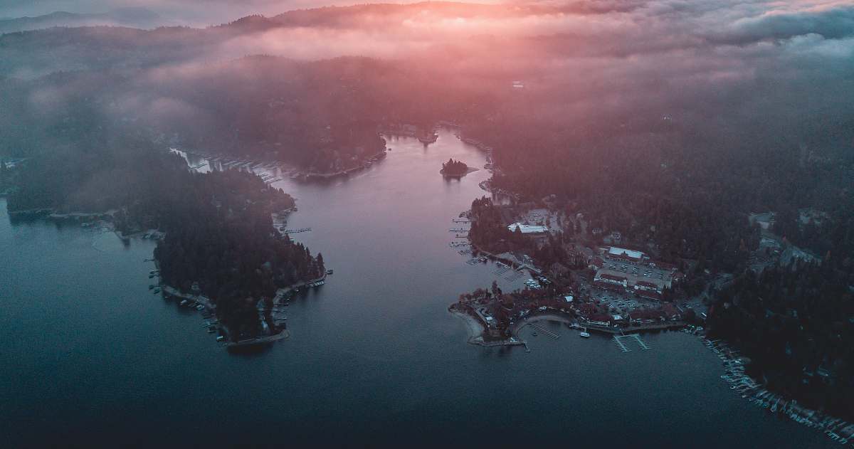sunset aerial photography of land and sea aerial view
