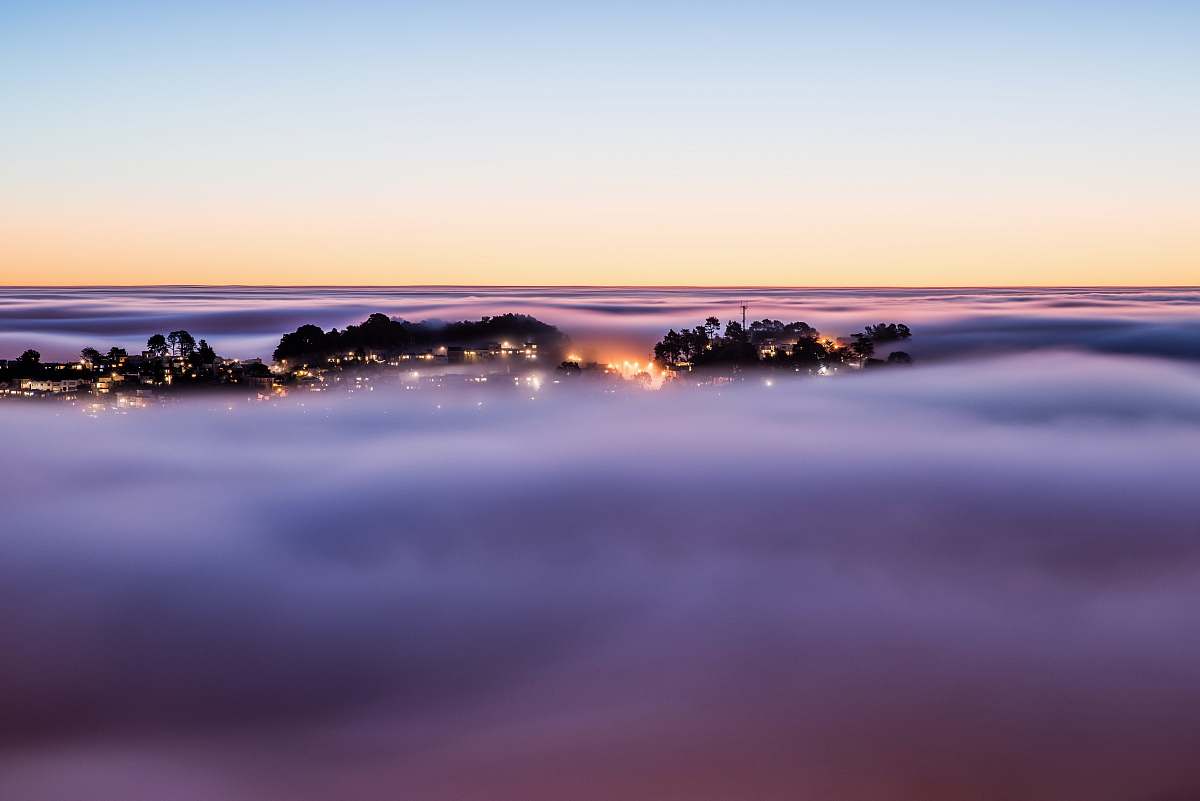 sunset The foggy sunrise over Twin Peaks in San Francisco lagoon